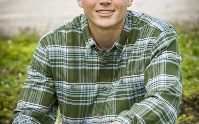 Boy portrait sitting in Riverbend Park in Jupiter, Florida