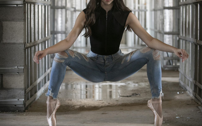 Dancer on pointe in hallway at construction site