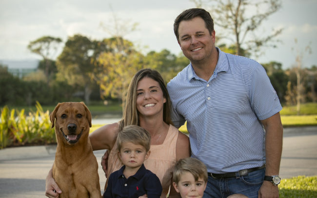 Family photo outdoors with kids and dog in Alton in Jupiter, Florida