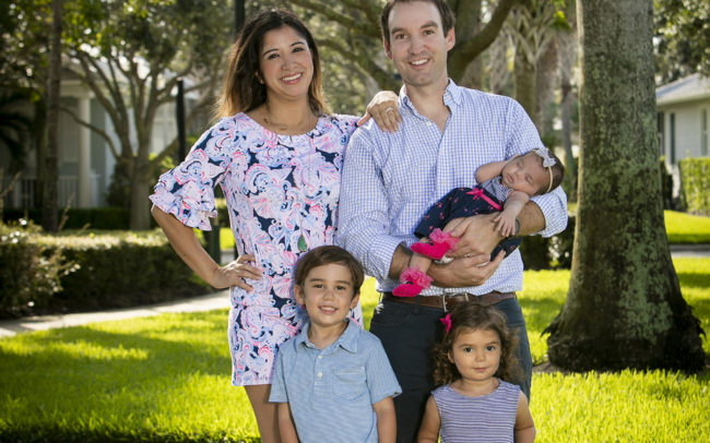 Family portrait in Abacoa in Jupiter, Florida standing in neighborhood